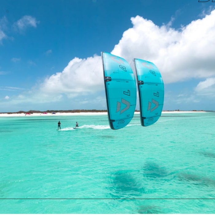 Two riders on Duotone Evo D/LAB 2027 kites over flat turquoise water