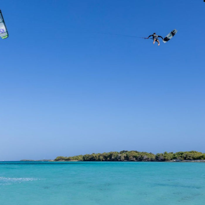 Kitesurfer boosting a big jump on a Duotone Rebel SLS 2027 kite