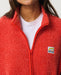 Close-up of the red Rip Curl fleece collar, front zip and chest logo