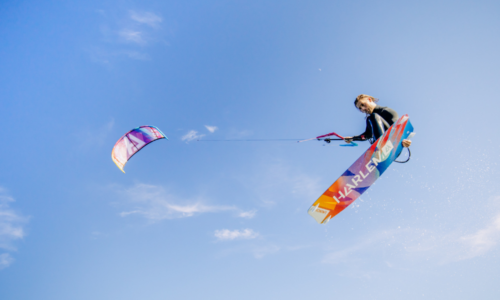 Rider jumping on the Harlem Launch V2 freeride kiteboard