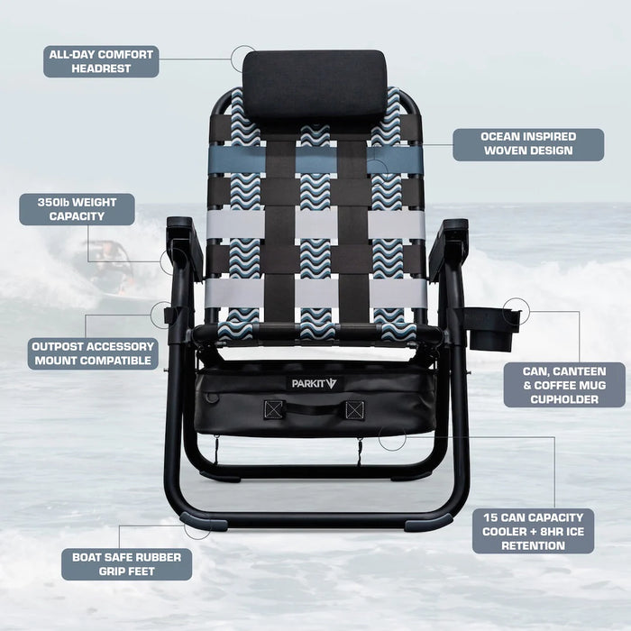 Parkit Eclipse Undertow reclining beach chair lifestyle shot in coastal setting showing ocean-tone woven webbing