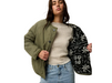 Rip Curl Bossa Nova Revo women’s reversible jacket in Military Green – model holding jacket open to show the patterned reverse