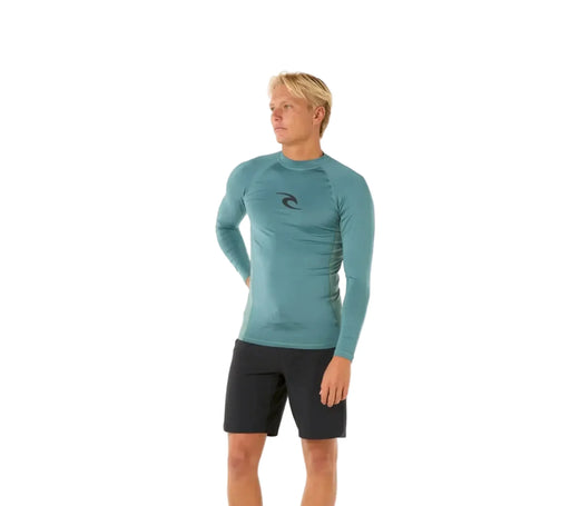 rip curl  teal long-sleeve rash guard and black shorts on a white background
