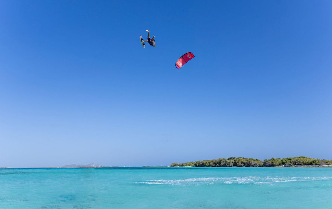 Duotone Jaime SLS 2027 during a freestyle aerial over a lagoon