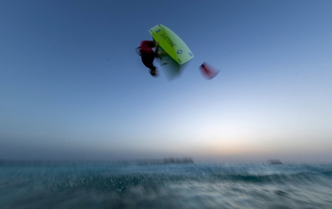 Duotone Jaime Concept Blue 2027 during a kitesurfing jump at dusk
