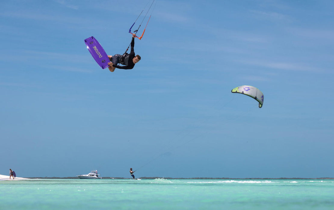 Duotone Jaime SLS 2027 during a freestyle aerial over turquoise water