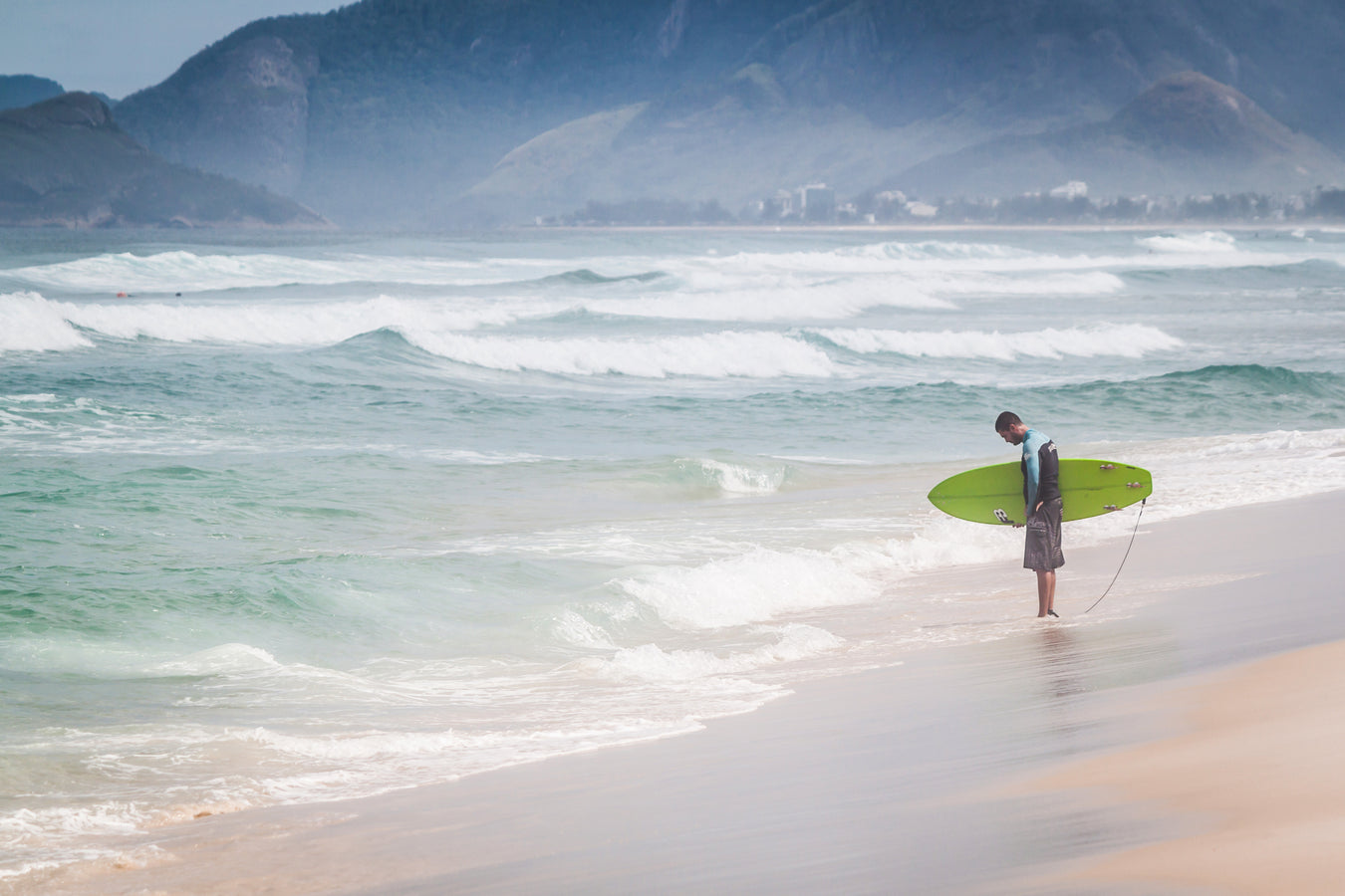 a-surfer-contemplates-the-water-s-edge - Boardworx