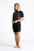 C-Skins Element womens shorty 3:2mm wetsuit in black and pink, front view on model