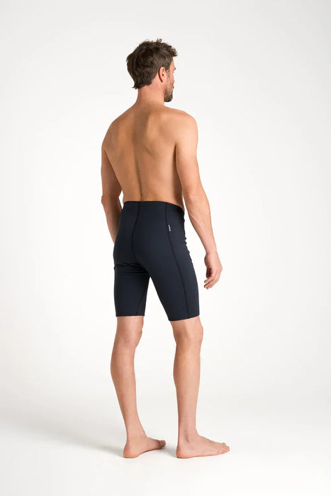 Man wearing black C-Skins HDi thermal wetsuit under shorts for watersports