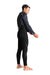 Man wearing C-Skins Legend 5:4:3 GBS back zip wetsuit in black, side view