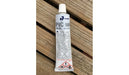 Carmo PVC seal glue 40ml tube for kite bladder repair, white tube on wooden surface