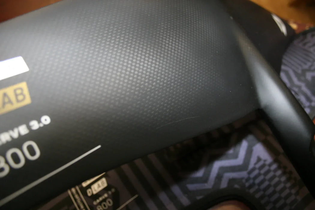 Duotone D-LAB Carve 3.0 800 black wing foil with textured surface close-up