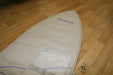 Duotone single surfboard bag 6ft, beige with blue accents, on wooden floor