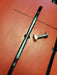 Duotone black wing foil track nut sled and bolt on an orange surface