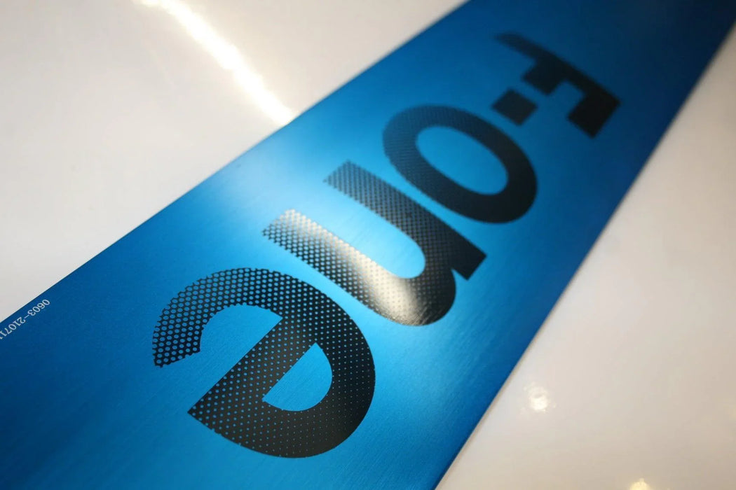 F-One Alu Foil Mast close-up in metallic blue with black logo lettering