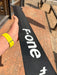 Close-up of F-one Carbon Mast 85 body showing F-one branding and carbon weave construction