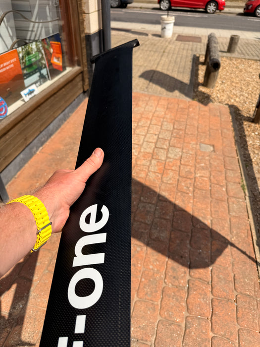 Leading edge profile of used F-one Carbon Mast 85 held up showing foil section and clean carbon condition