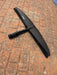 Top view of used F-one Eagle 1290 HM Carbon wing foil front wing on brick paving showing F-one logo and carbon construction