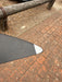Overhead close-up of right wingtip of used F-one Eagle 1290 HM Carbon showing white tip protector and carbon weave surface