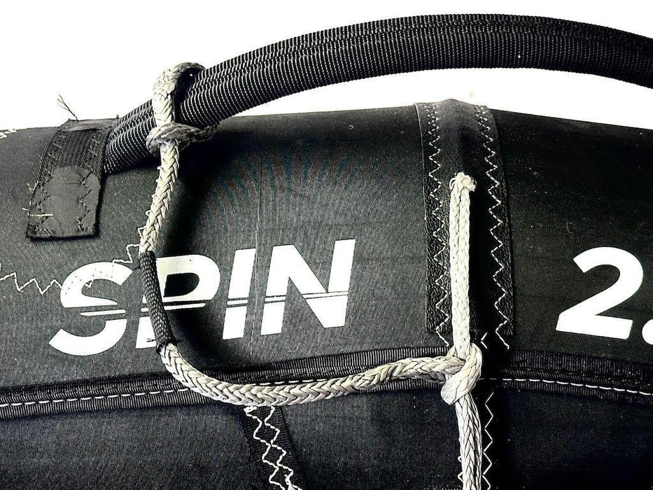 Black SPIN 2.5 wing foil leash with braided Dyneema cord and reinforced stitching, watersports accessory.