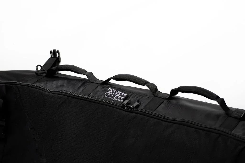 FBC Down Wind mid-length black travel bag for surfboards with multiple carry handles