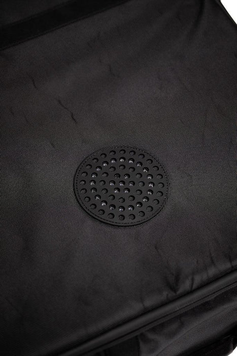 Close-up of black watersports gear bag with vented drainage panel, durable fabric visible