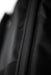 Black textured wing board bag detail with close-up of durable zip and fabric