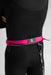The Foil Board Company pink waist leash for wing foiling, worn over a black wetsuit