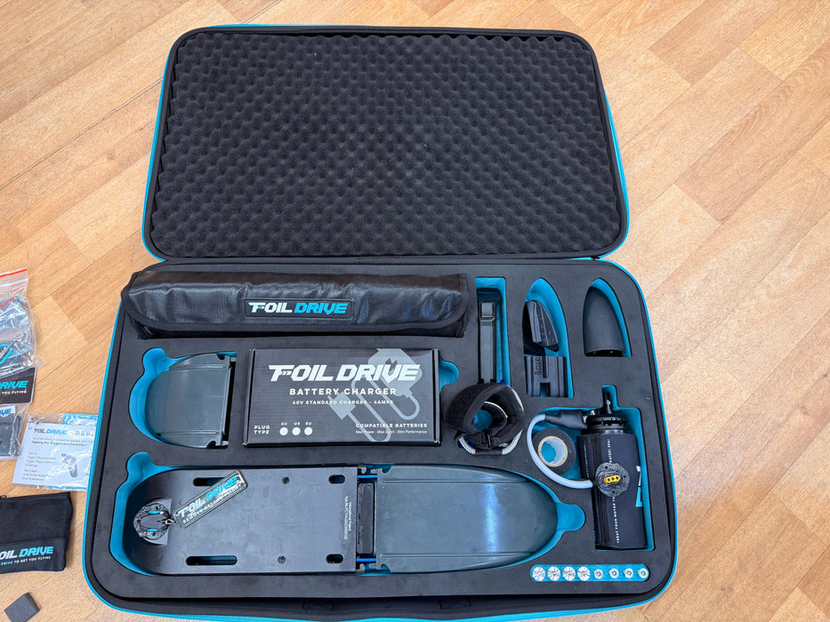 Foil Drive Assist MAX Gen 1 complete kit — both hard cases open showing all motors, battery, charger and accessories — Board-Worx