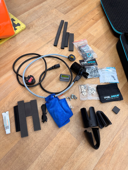 Foil Drive Assist MAX Gen 1 complete kit in main case showing MAX battery, 40V charger box, Foil Drive bag and motor — Board-Worx