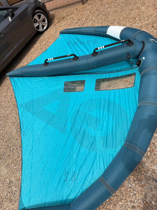 Used GA Wings Cross 6.2 2023 wingfoil wing — top-down view of strut with four hard handles and clear windows