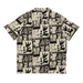 Beige short-sleeve shirt with black abstract surf graphic print, camp theme pattern.