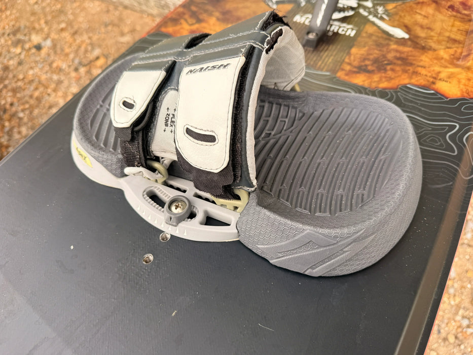 Naish Monarch kiteboard footstrap and textured grey pad close-up, kitesurfing equipment