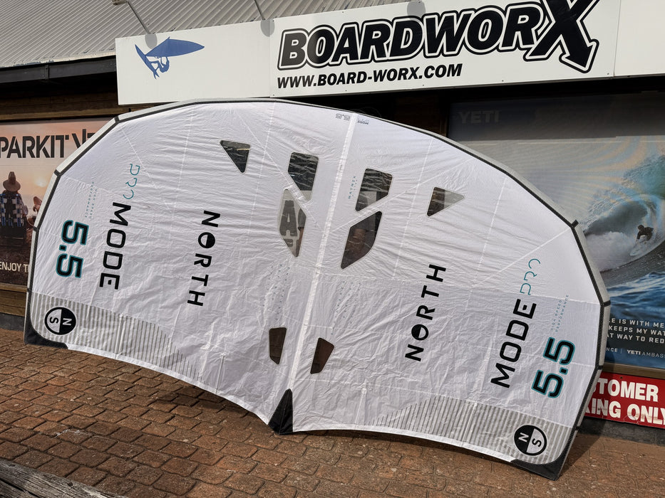 North Mode Pro 2024 5.5m wing held up outside the Board-Worx shop in Whitstable