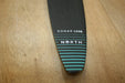 North Sonar S238 foil stabilizer, black with blue stripes, on wooden surface