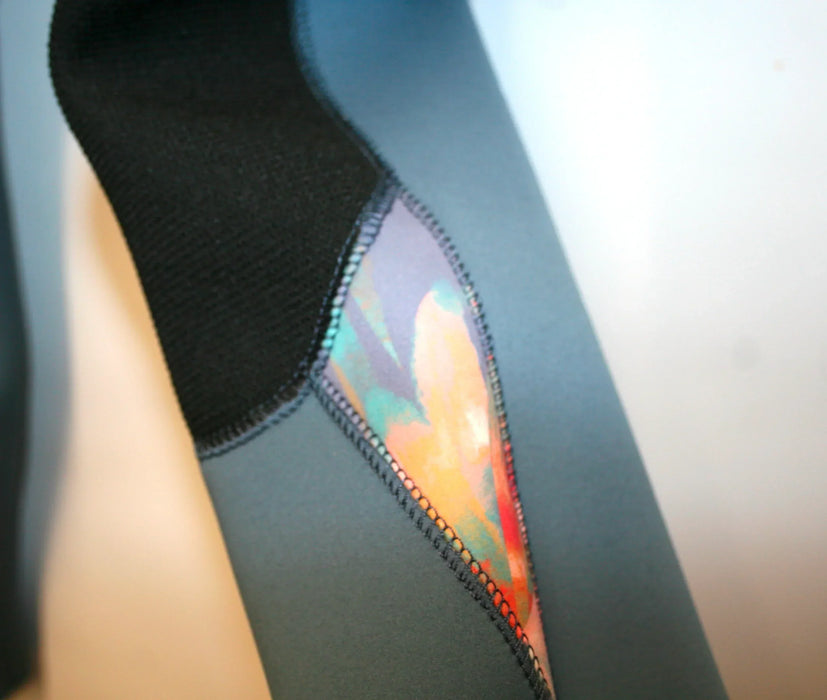 O'Neill Epic womens wetsuit close-up, blue fabric with painted tropics panel detail
