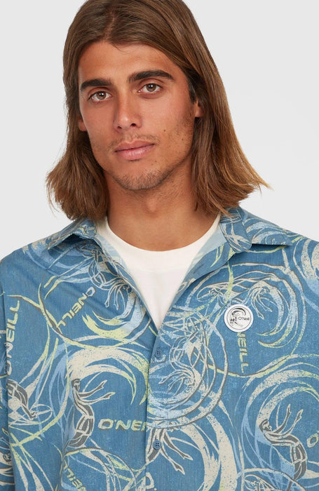 O'Neill blue short sleeve surf shirt with wave print and UPF 50, worn by male model