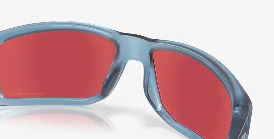 Matte transparent blue sunglasses with red mirrored lenses, close-up view.