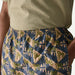 Palm print board shorts with navy, green, and pink design for watersports