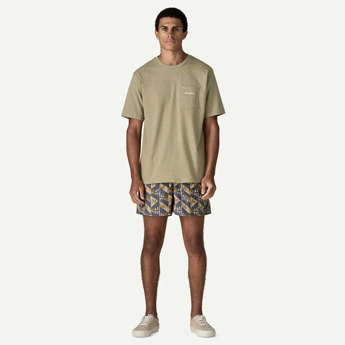 Patagonia olive t-shirt with pocket and patterned board shorts for watersports