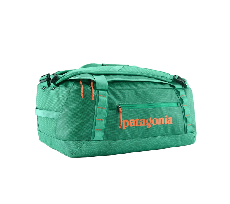 Green duffel bag with Patagonia logo on a white background