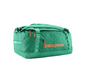 Green duffel bag with Patagonia logo on a white background