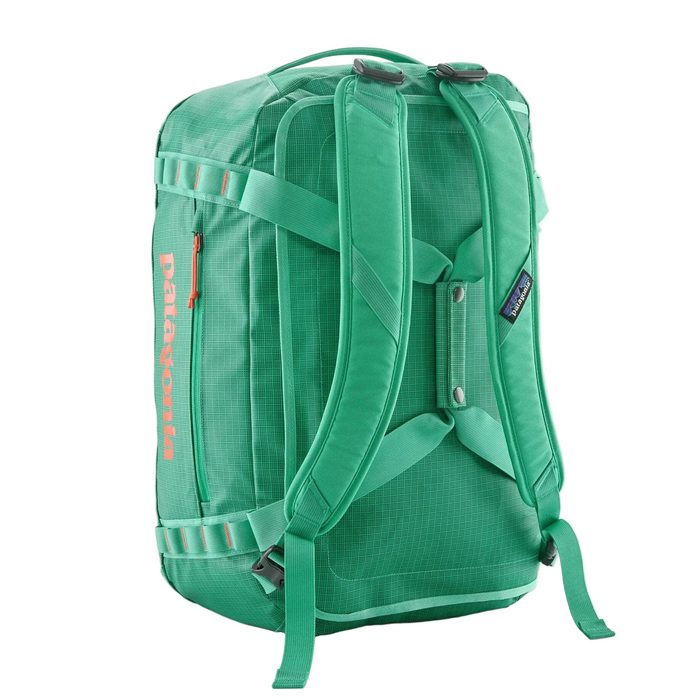 Green backpack with visible Patagonia branding on a white background