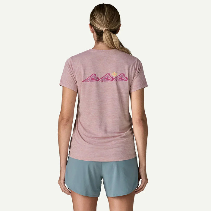 Woman wearing Patagonia Capilene Cool Daily pink shirt with mountain graphic on back