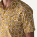 Patagonia short sleeve shirt with yellow floral print on white, beachwear style