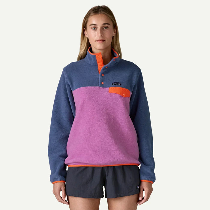 Patagonia lightweight Synchilla Snap-T fleece pullover in brisk purple with orange accents, worn by woman