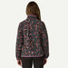 Woman wearing Patagonia fleece pullover with abstract pink and green pattern, back view