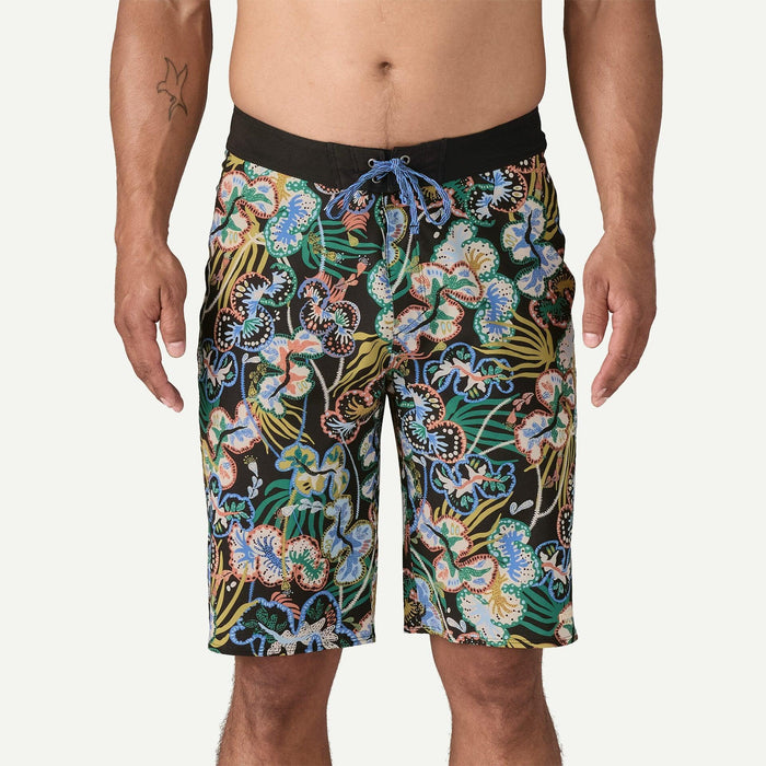Men's floral print boardshorts with black waistband and blue drawstring, watersports clothing