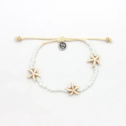Pineapple Island shell bracelet set with white beads and starfish accents on adjustable cord