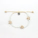 Pineapple Island shell bracelet set with white beads and starfish accents on adjustable cord